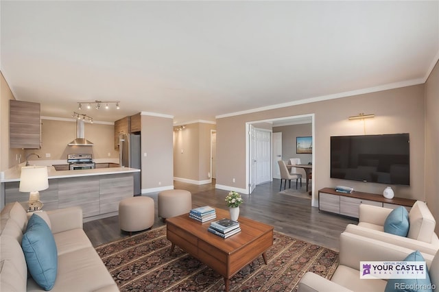 living area featuring baseboards, dark wood-style flooring, and crown molding