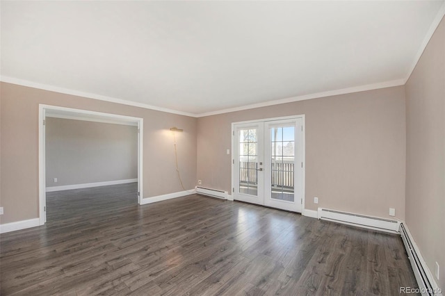 spare room featuring a baseboard heating unit, ornamental molding, dark wood-style flooring, and french doors