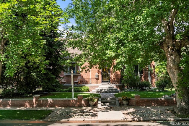 1265 S Elizabeth St, Denver, CO 80210 - view of home's community featuring a lawn