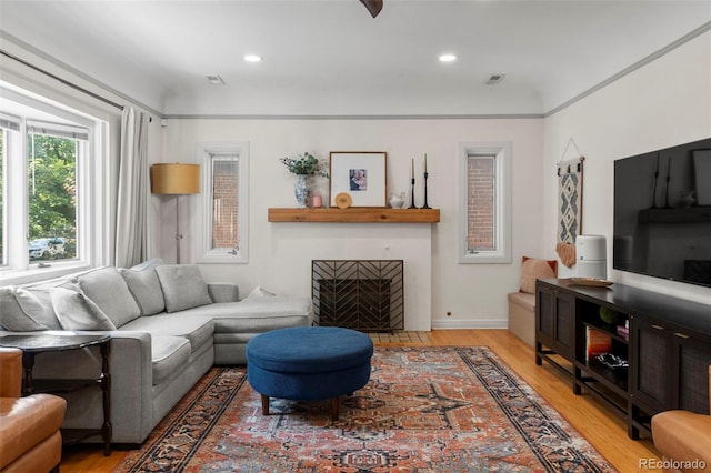 1265 S Elizabeth St, Denver, CO 80210 - living room with light wood finished floors, a fireplace with flush hearth, and recessed lighting