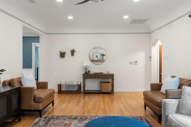 1265 S Elizabeth St, Denver, CO 80210 - living room with arched walkways, ceiling fan, light wood-type flooring, and recessed lighting