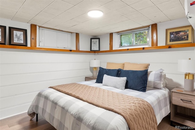 1265 S Elizabeth St, Denver, CO 80210 - bedroom with wood finished floors and a decorative wall