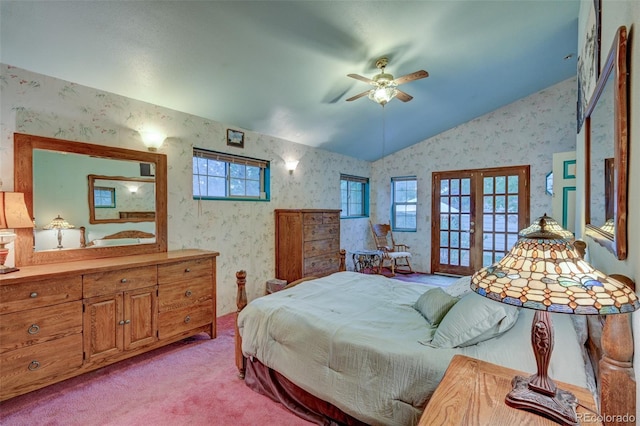 319 W Arkansas St, Buena Vista, CO 81211 - bedroom featuring wallpapered walls, vaulted ceiling, french doors, multiple windows, and light carpet