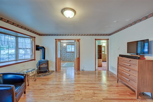319 W Arkansas St, Buena Vista, CO 81211 - living room featuring a wood stove and light wood-style floors