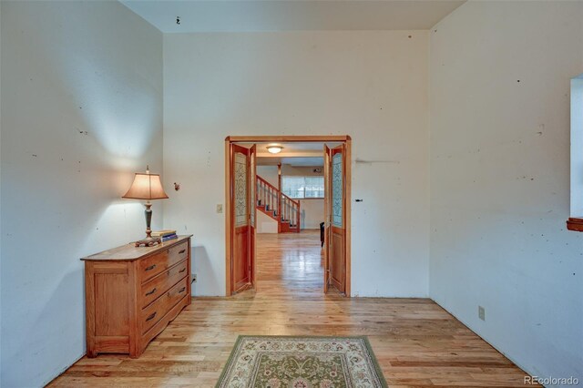 319 W Arkansas St, Buena Vista, CO 81211 - hall with light wood-style flooring and stairway