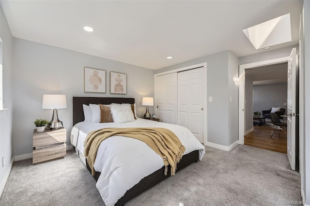 bedroom with recessed lighting, a closet, carpet, and baseboards