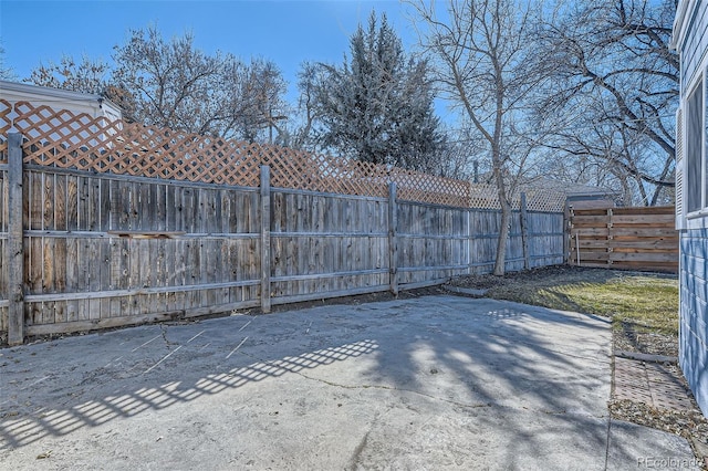 view of gate featuring a fenced backyard