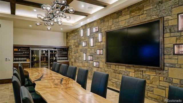 dining room featuring beam ceiling and an inviting chandelier