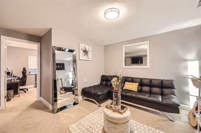 living area with baseboards, carpet flooring, a textured ceiling, and visible vents