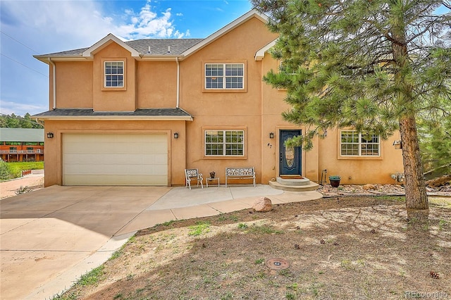 view of front of property featuring a garage