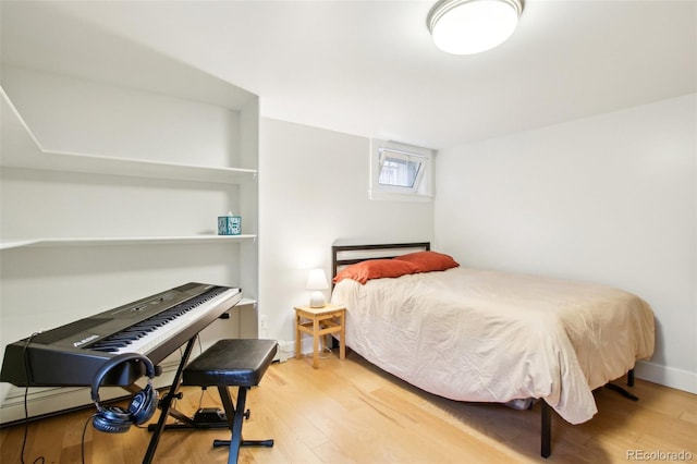 bedroom with wood finished floors