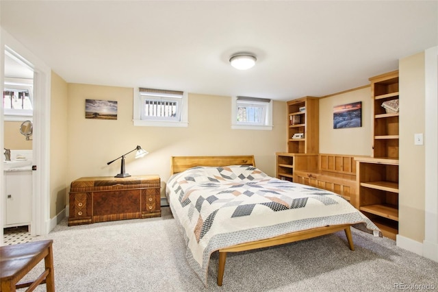 bedroom featuring carpet floors, baseboards, and baseboard heating