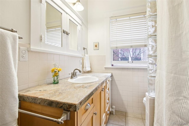 4253 Hooker St, Denver, CO 80211 - bathroom with tile walls, tile patterned flooring, a wainscoted wall, vanity, and toilet