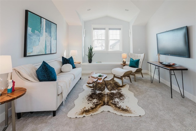 living room with light colored carpet and vaulted ceiling