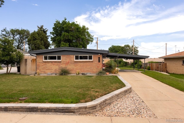 7820 Grove St, Westminster, CO 80030 - ranch-style house with brick siding, an attached carport, and concrete driveway
