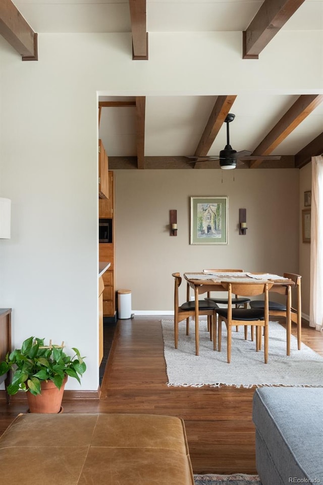 7820 Grove St, Westminster, CO 80030 - dining room featuring beam ceiling, dark wood-style flooring, and a ceiling fan