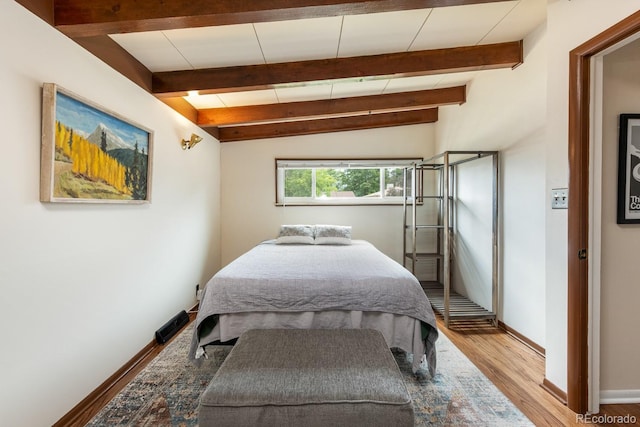7820 Grove St, Westminster, CO 80030 - bedroom featuring wood finished floors and beam ceiling