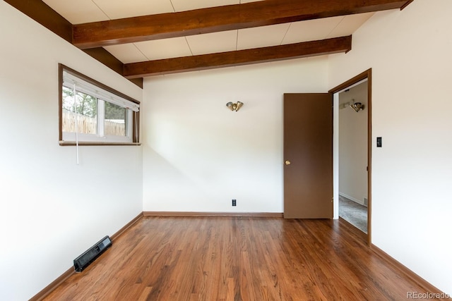 7820 Grove St, Westminster, CO 80030 - unfurnished room featuring wood finished floors and beam ceiling