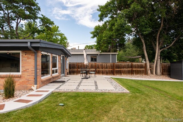 7820 Grove St, Westminster, CO 80030 - fenced backyard with a patio area