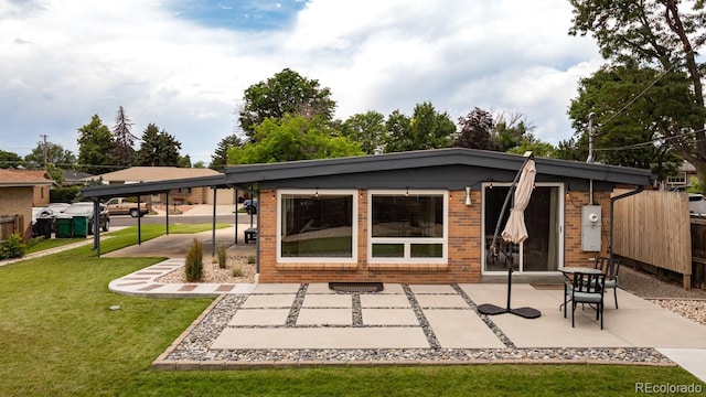 7820 Grove St, Westminster, CO 80030 - rear view of house featuring brick siding and a patio