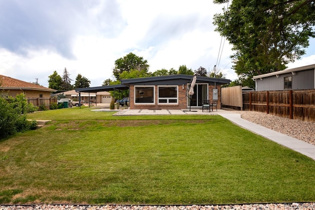 7820 Grove St, Westminster, CO 80030 - rear view of house with an attached carport and a patio area