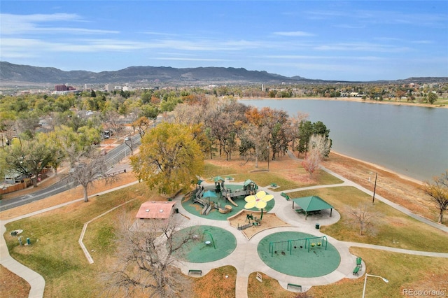 birds eye view of property with a water and mountain view