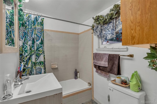 full bathroom with shower / tub combo with curtain, vanity, and toilet