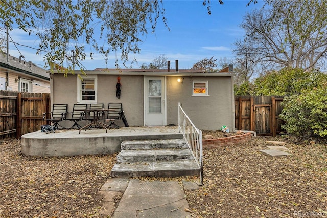 back of house featuring a patio