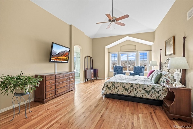 bedroom featuring visible vents, vaulted ceiling, ceiling fan, light wood-type flooring, and baseboards