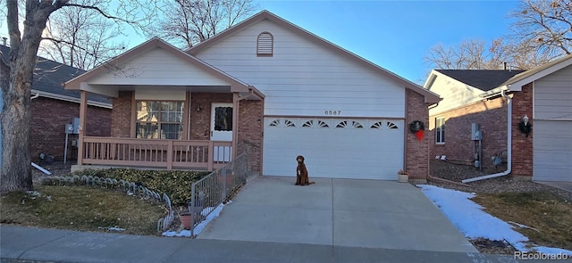 view of front of house with covered porch and a garage