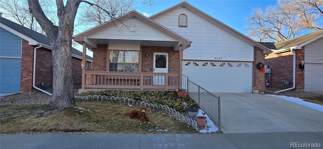 view of front facade featuring a porch and a garage