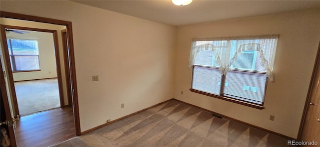 spare room with carpet floors