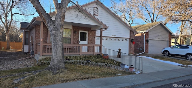 view of front of home featuring covered porch and a garage