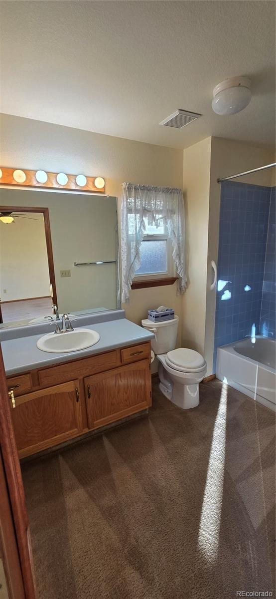 full bathroom with vanity, toilet, and  shower combination