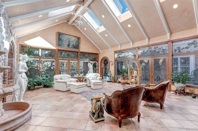 sunroom / solarium with lofted ceiling with skylight