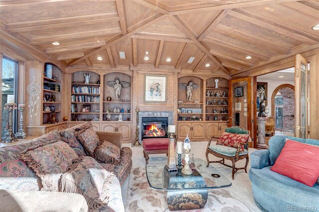 living room featuring wood walls, built in features, a high end fireplace, and wooden ceiling