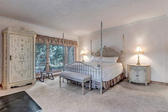 bedroom with baseboards, carpet flooring, and crown molding