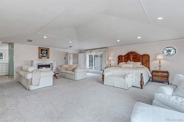 carpeted bedroom with recessed lighting, visible vents, vaulted ceiling, and a high end fireplace