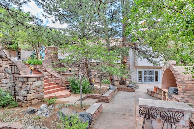 view of patio / terrace featuring area for grilling and french doors