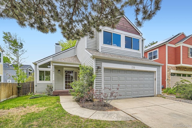 744 Owl Dr, Louisville, CO 80027 - view of front of home featuring driveway, a garage, a chimney, and a shingled roof