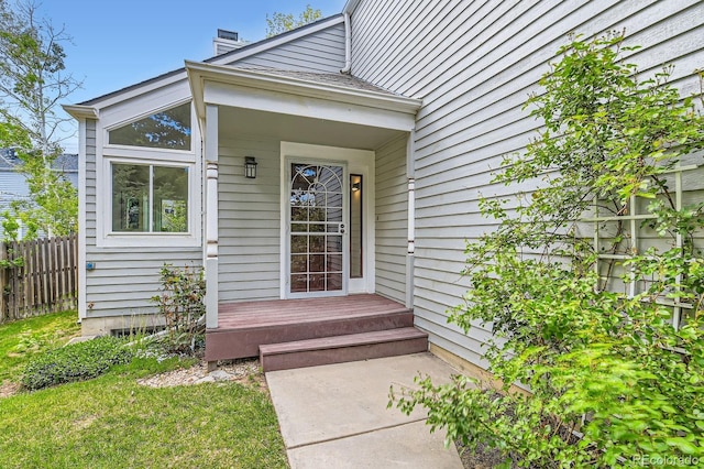 744 Owl Dr, Louisville, CO 80027 - view of exterior entry with a chimney