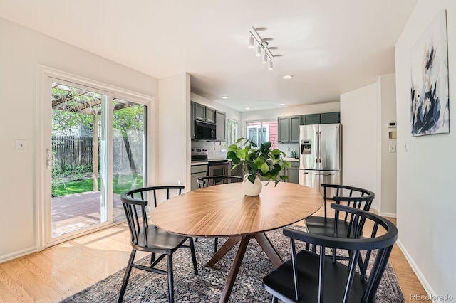 744 Owl Dr, Louisville, CO 80027 - dining area featuring baseboards, light wood-style floors, and track lighting
