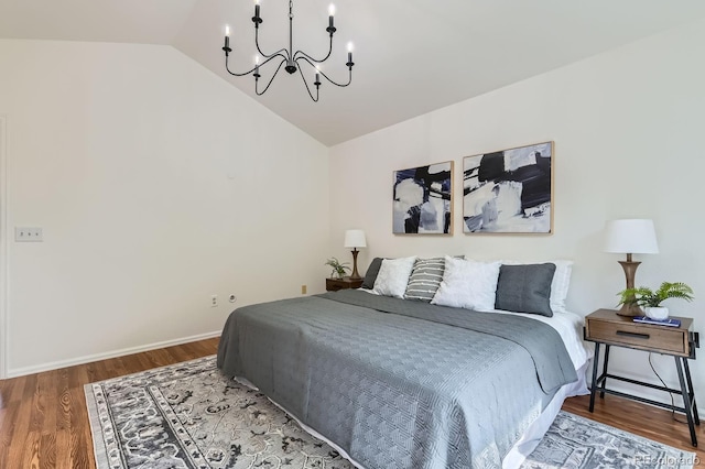 744 Owl Dr, Louisville, CO 80027 - bedroom featuring a chandelier, lofted ceiling, wood finished floors, and baseboards