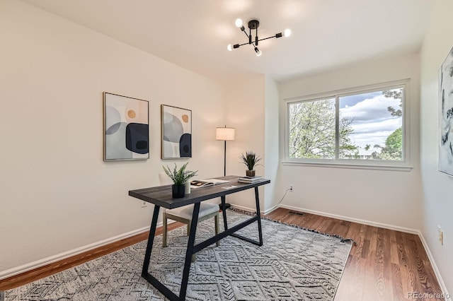 744 Owl Dr, Louisville, CO 80027 - office space with a chandelier, wood finished floors, and baseboards