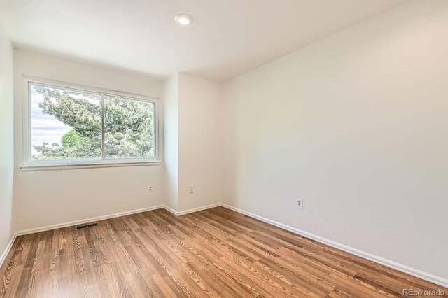 744 Owl Dr, Louisville, CO 80027 - spare room featuring light wood finished floors, baseboards, and recessed lighting