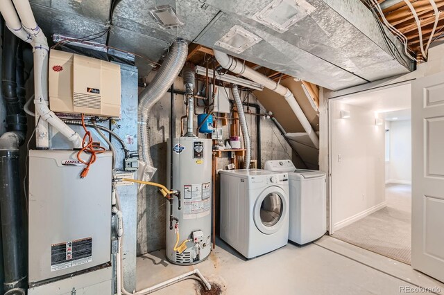 744 Owl Dr, Louisville, CO 80027 - utility room featuring gas water heater and washing machine and clothes dryer