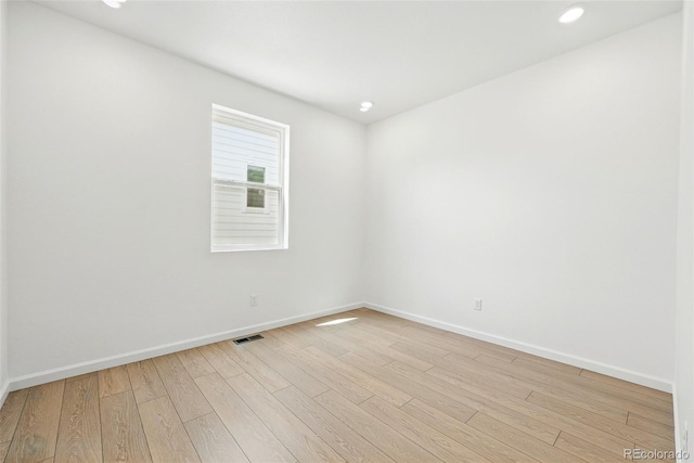 spare room with recessed lighting, baseboards, visible vents, and light wood-style flooring