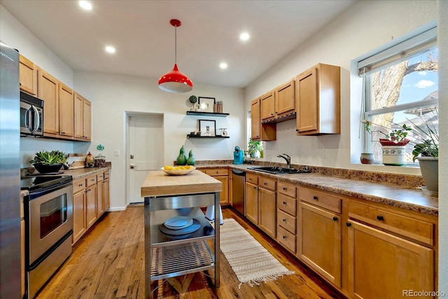 kitchen with open shelves, recessed lighting, a sink, stainless steel appliances, and light wood-type flooring