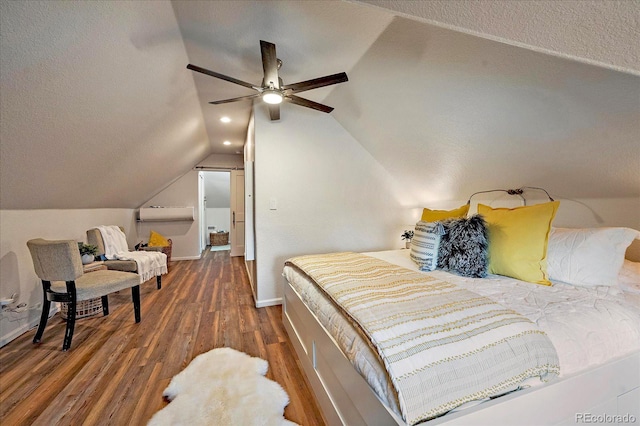 bedroom with ceiling fan, lofted ceiling, recessed lighting, wood finished floors, and a textured ceiling