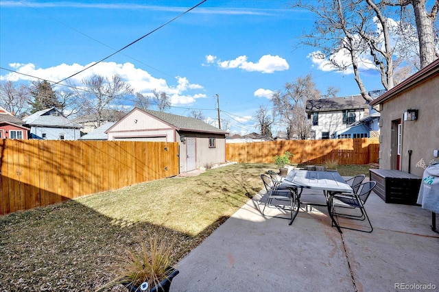 view of yard featuring outdoor dining space, a patio, and a fenced backyard